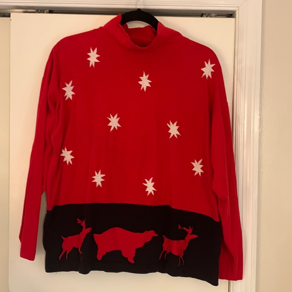 Cotton, mock turtleneck with stars and animals in red and black.